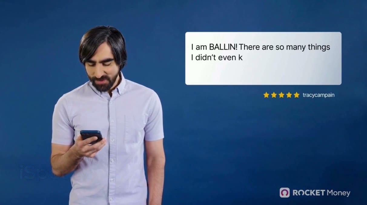 A customer reading his phone beside his own five-star review: I am BALLIN! There are so many things I didn't even know I had billing me