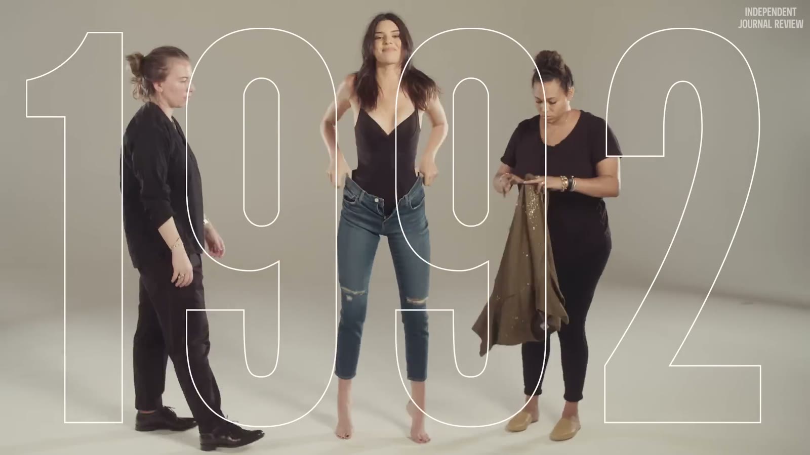The crew changing Kendall's outfit, 1992 in outline behind her